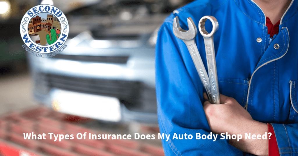 Mechanic in blue coveralls holding wrenches with a blurred background of a car, alongside the Second Western Insurance Services logo.